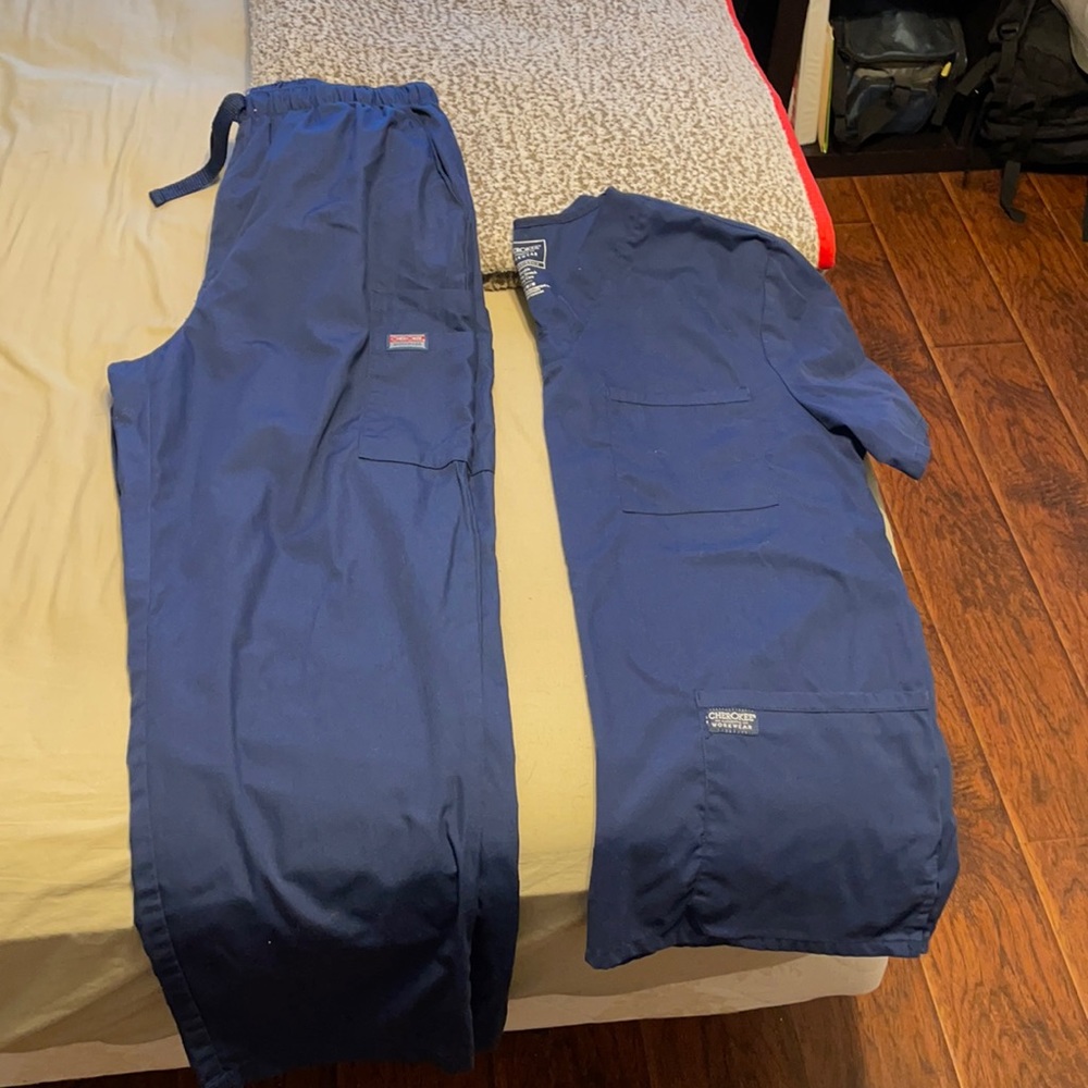 3 sets of navy Cherokee scrub tops and bottoms.